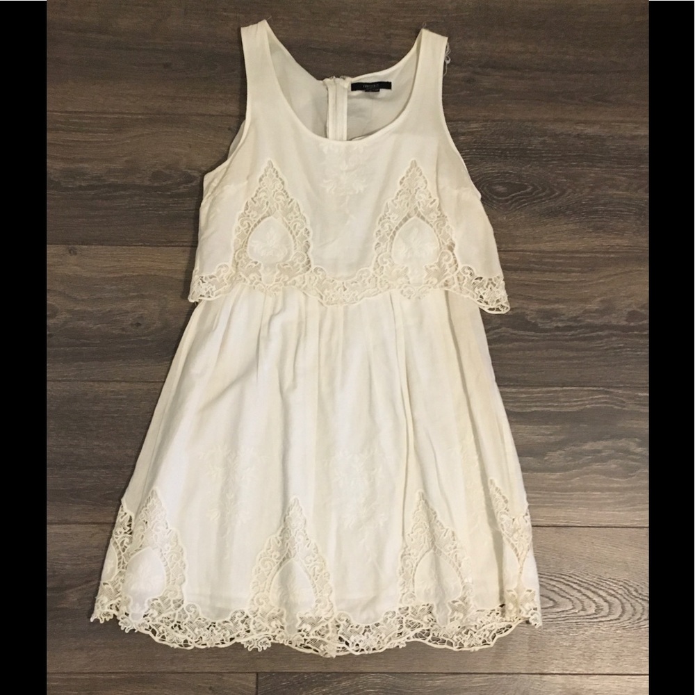 White, lace embroidered detailed dress.